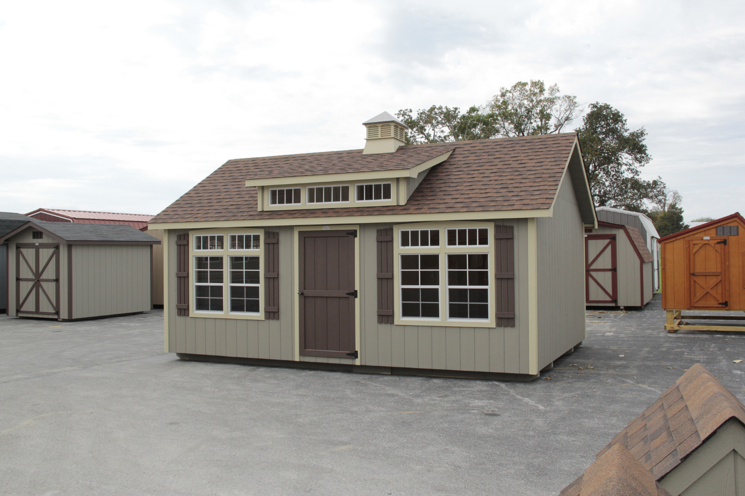 12x14 beige shed with brown door and windows
