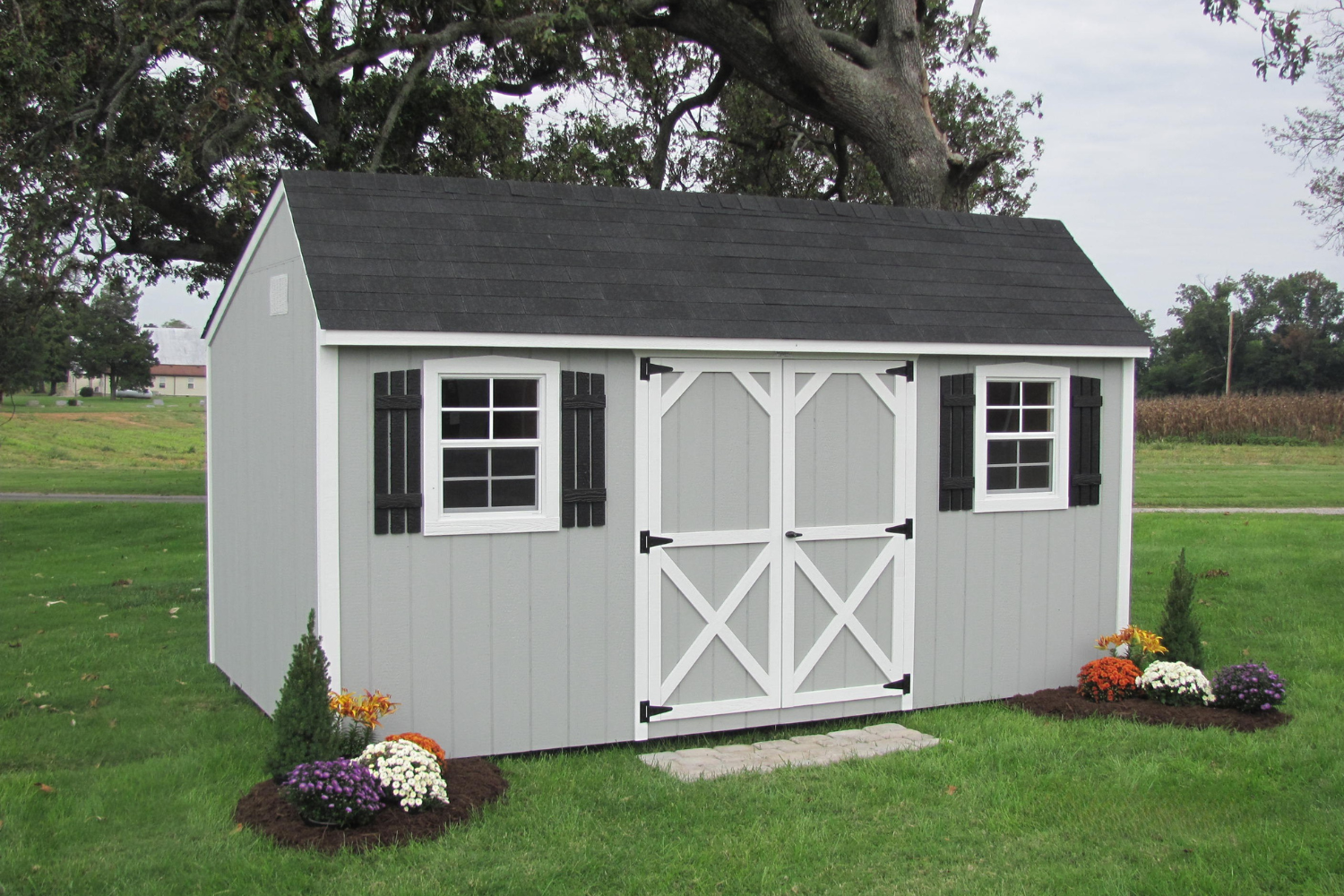 12x28 gray quaker shed with white trim and double doors