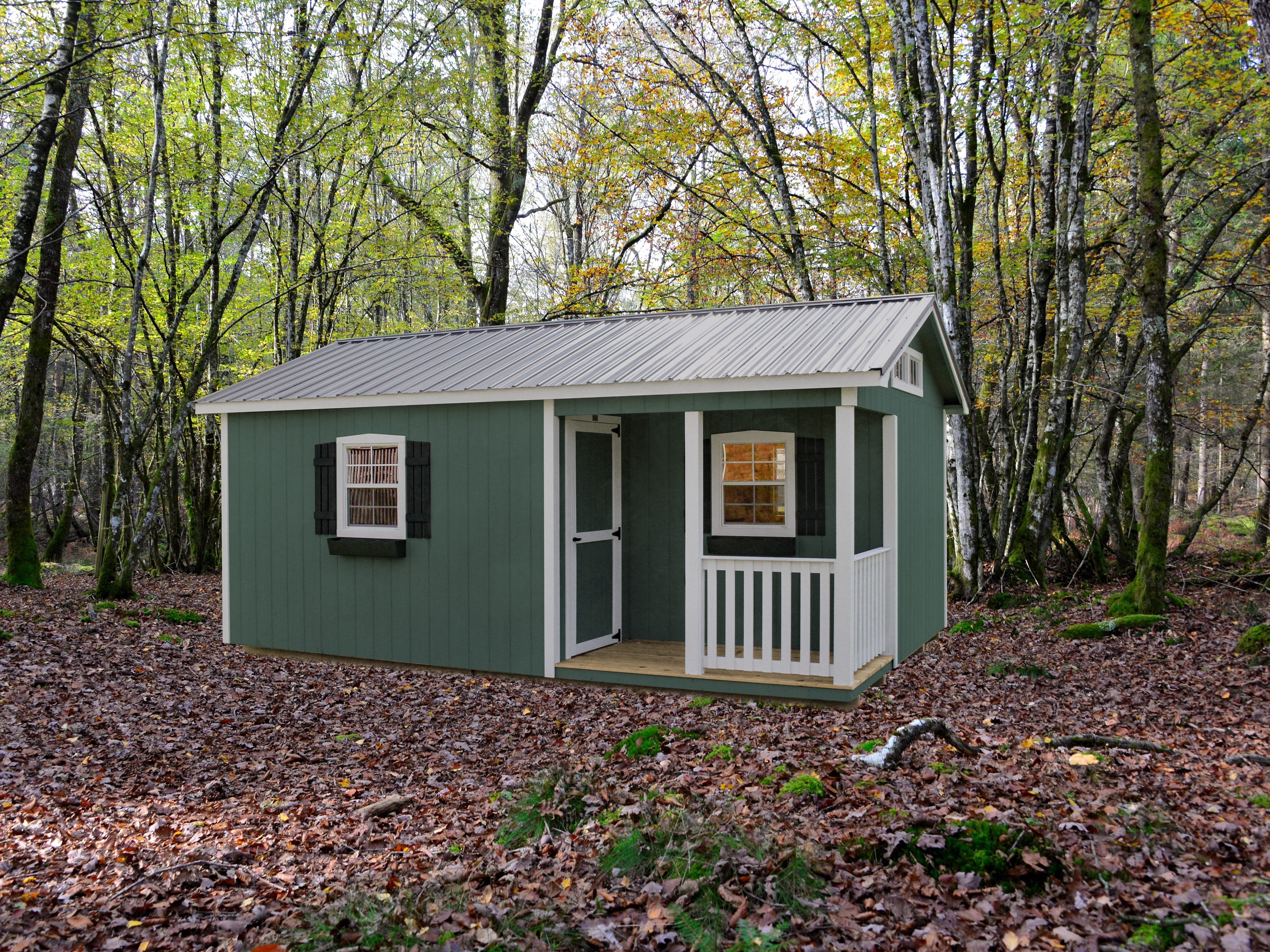 green cabins for sale in Nashville TN with white trim front porch and brown metal roof