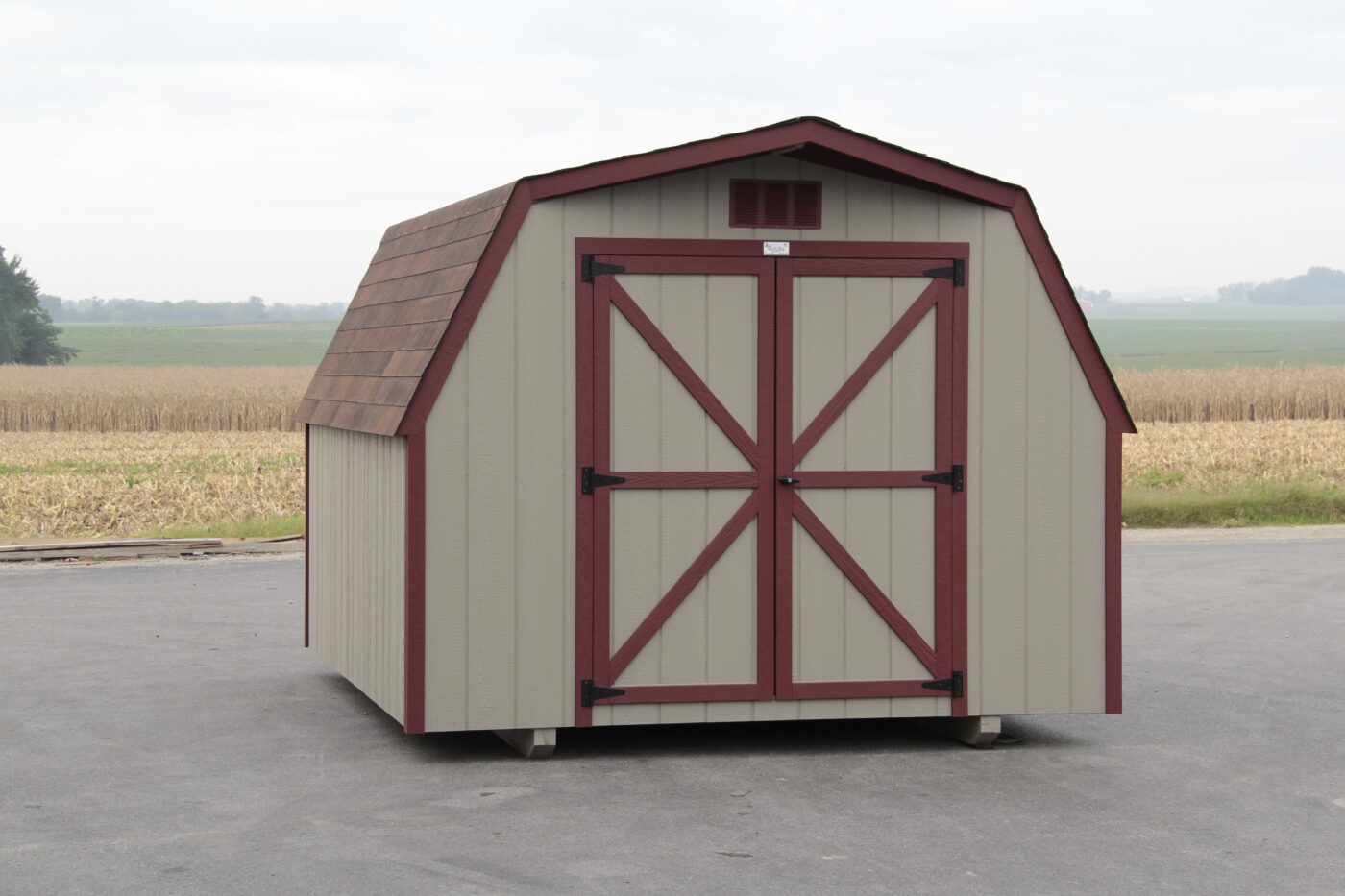 tan and red trimmed Barn shed portable building