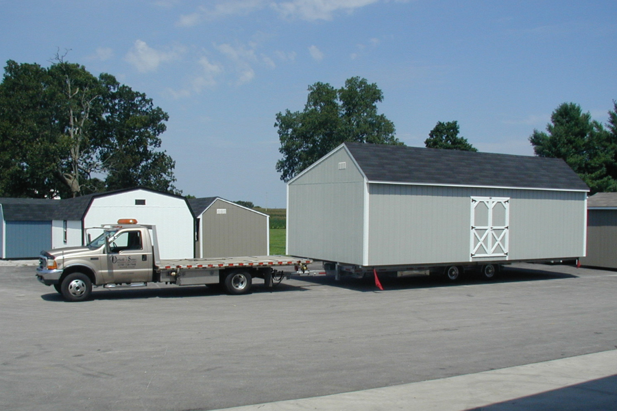 green and white shed being delivered in Nashville